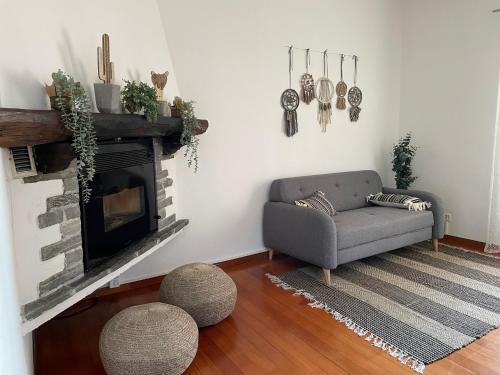 a living room with a couch and a fireplace at Ascona: CÀ DAL DOLZ in Ascona