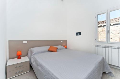 Säng eller sängar i ett rum på Attico Biennale Venezia Nuovissimo