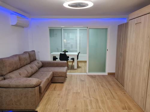a living room with a couch and a table at Hany apartment Ducado 11-C in Benidorm