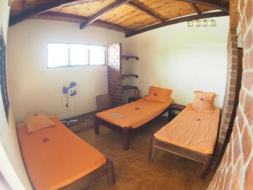 Postel nebo postele na pokoji v ubytování La Case Sakalava