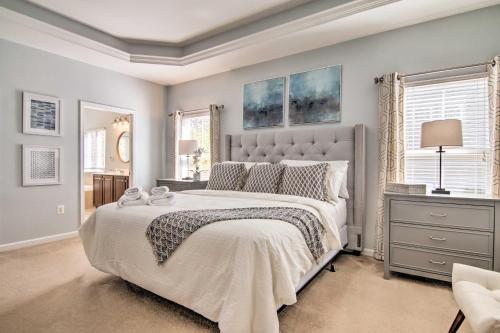 a bedroom with a large bed with a white bedspread at Near Bethany Beach Family Home with Patio and BBQ in Ocean View