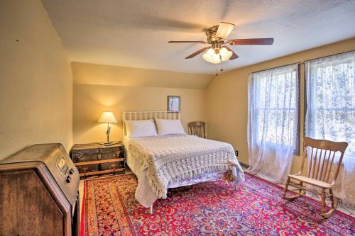 a bedroom with a bed and a ceiling fan at Remote Escape Riverside Home with Scenic Views in Idanha