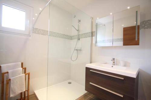 a bathroom with a sink and a shower at Residence Catherine in Calvi