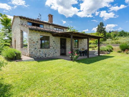 an external view of a stone house with a garden at Villa Villa Alba by Interhome in Mattone