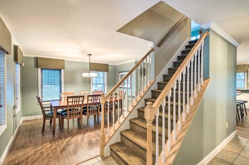 a dining room and kitchen with a staircase and a dining table at North Conway Home about 2 Mi to Cranmore Mountain! in North Conway