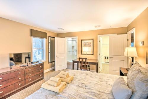 a bedroom with a large bed and a desk at North Conway Home about 2 Mi to Cranmore Mountain! in North Conway