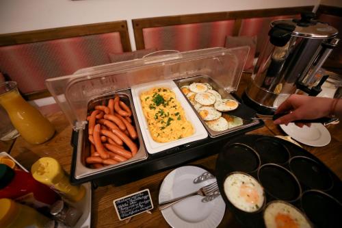 a tray of food on a table with food at Hotel Tábor in Tábor