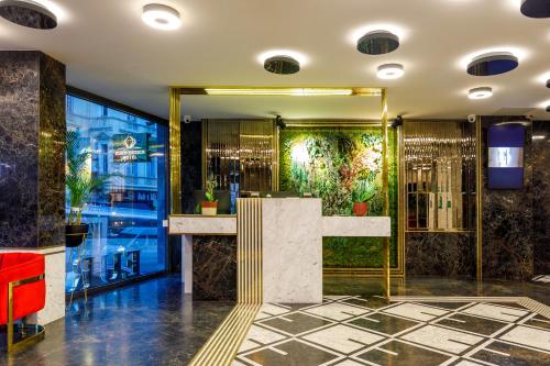 a lobby of a hotel with a bar and a window at Euro Design Hotel in Istanbul