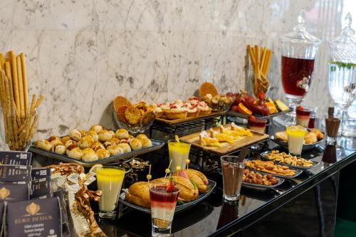 a buffet with many different types of food and drinks at Euro Design Hotel in Istanbul