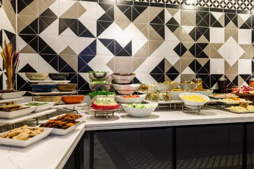 a buffet with many different types of food on a table at Euro Design Hotel in Istanbul