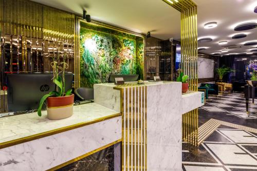 a lobby of a hotel with yellow and gold stripes at Euro Design Hotel in Istanbul