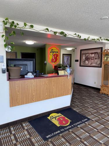 a fast food restaurant with a counter in a room at Super 8 by Wyndham Toledo in Toledo