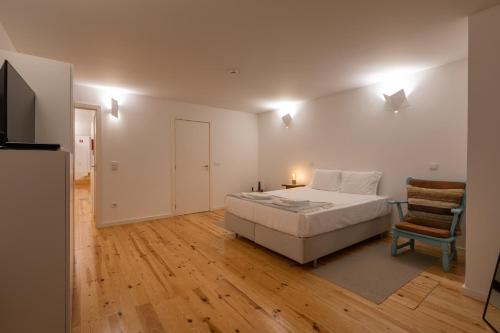 Ένα ή περισσότερα κρεβάτια σε δωμάτιο στο ORM Torrinha Apartment