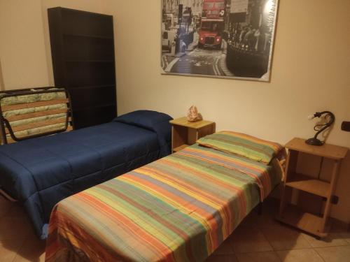 Postel nebo postele na pokoji v ubytování Scorcio sul Mare