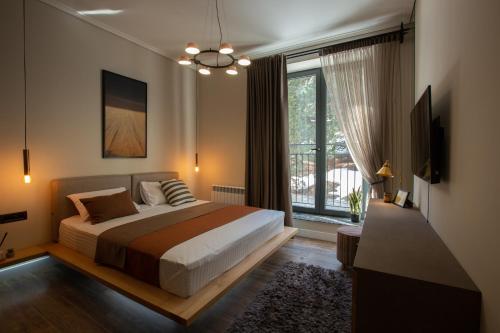 Säng eller sängar i ett rum på Luxury Cottage in Tsaghkadzor by Downtown Inn