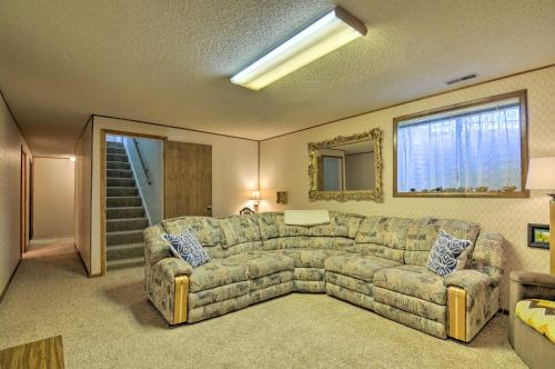 a living room with a couch and a window at Bryce Canyon Area House with Mountain Views! in Tropic