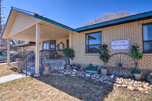 a house with a sign on the side of it at Bryce Canyon Area House with Mountain Views! in Tropic