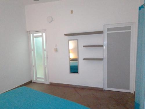Una cama o camas en una habitación de Residencia Jacarandas