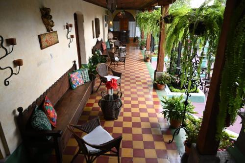 a view of a restaurant with a checkered floor at Hotel Palacio Chico 1948 in Antigua Guatemala