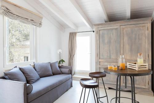 a living room with a couch and a table at Palazzo Sant'Anna Lecce in Lecce