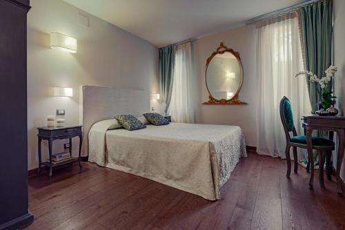 Säng eller sängar i ett rum på Locanda Fiorita