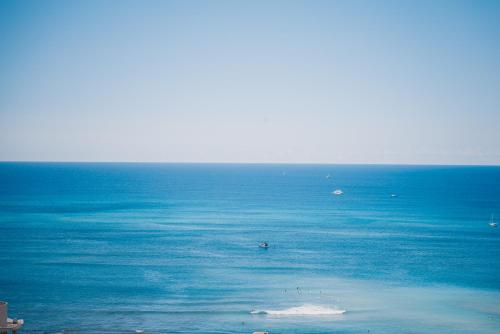 a large body of water with a small island in it at Pacific Monarch Hotel in Honolulu