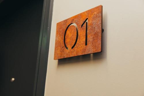 a clock on a wall with the number forty on it at Quarter by the Warren Collection in Belfast