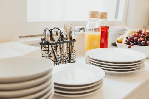a group of plates and spoons sitting on a counter at Quarter by the Warren Collection in Belfast