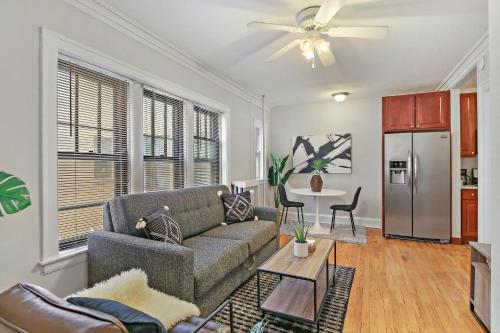 a living room with a couch and a table at 1BR Calm & Cozy Apt in Lincoln Square - Eastwood 2S in Chicago