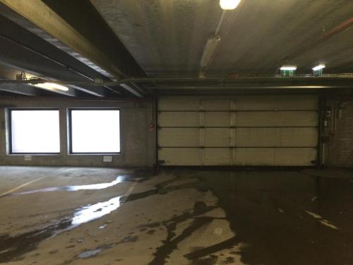 an empty room with two windows in a building at Reykjavík City Town Apartments in Reykjavík
