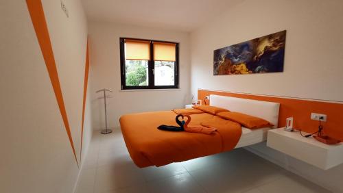 A bed or beds in a room at Blue Sky Garda - Sunset