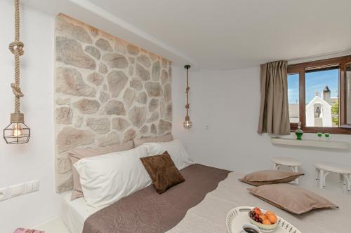 Posteľ alebo postele v izbe v ubytovaní Geolenas Home - Naxian Old Agora