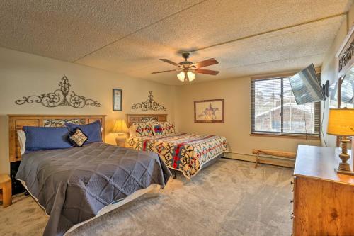 a bedroom with two beds and a ceiling fan at Copper Mountain Condo Walk to American Eagle Lift in Copper Mountain