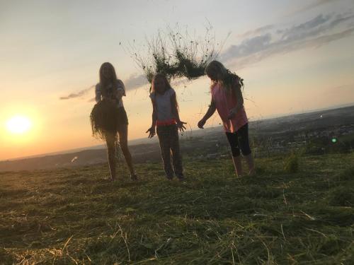 a group of three girls standing on top of a hill at Landhaus Aigner in Allhartsberg
