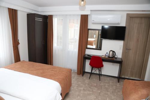 Cama o camas de una habitación en HOTEL GLOBAL 2022