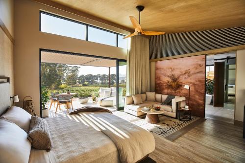 a bedroom with a bed and a large window at Stanly Ranch, Auberge Collection in Napa