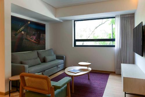 a living room with a couch and a table at V65 Mx in Mexico City