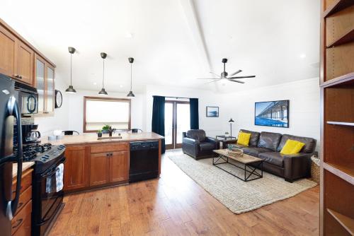 a kitchen and living room with a couch and a table at 358 Front Street in Avila Beach