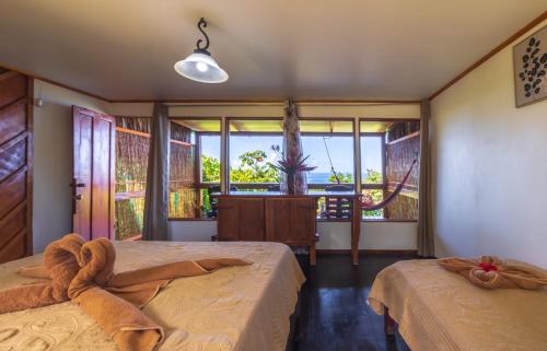 Кровать или кровати в номере Punta Marenco Lodge