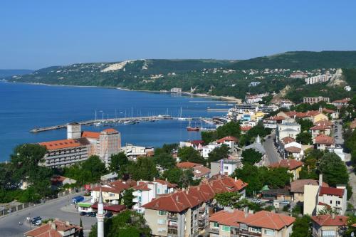 a view of a city with a harbor and a body of water at Family Hotel Magnolia in Balchik