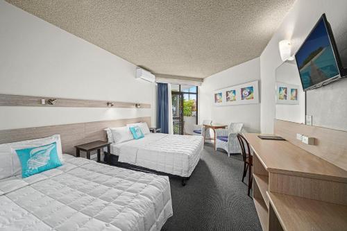 Postel nebo postele na pokoji v ubytování East Port Motor Inn