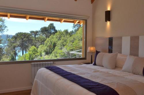 Ένα ή περισσότερα κρεβάτια σε δωμάτιο στο Posada La Escondida