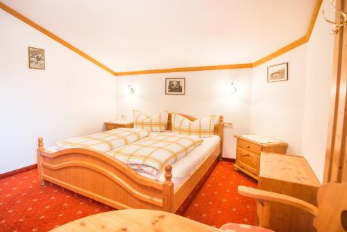 Postel nebo postele na pokoji v ubytování Haus Gleinser - Neustift im Stubaital