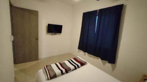 Ένα ή περισσότερα κρεβάτια σε δωμάτιο στο Casa maleni 2 en mismaloya