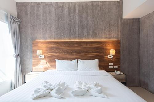 The Proud Exclusive Hotel-SHA Plus tesisinde bir odada yatak veya yataklar