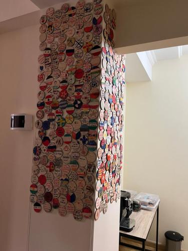 a wall covered with many different types of plates at ArevaHostel&Apartment in Yerevan