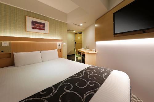 Säng eller sängar i ett rum på Keio Presso Inn Nihonbashi Kayabacho
