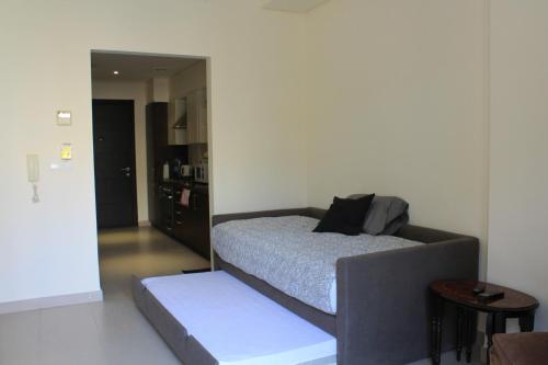Un pat sau paturi într-o cameră la Samarah Dead Sea Resort Studio-CP6 Traveler Award 2023 Winner