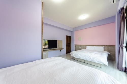 Ένα ή περισσότερα κρεβάτια σε δωμάτιο στο Dragon Crane Resort