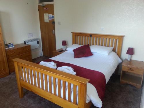 En eller flere senge i et værelse på Chester Lodge